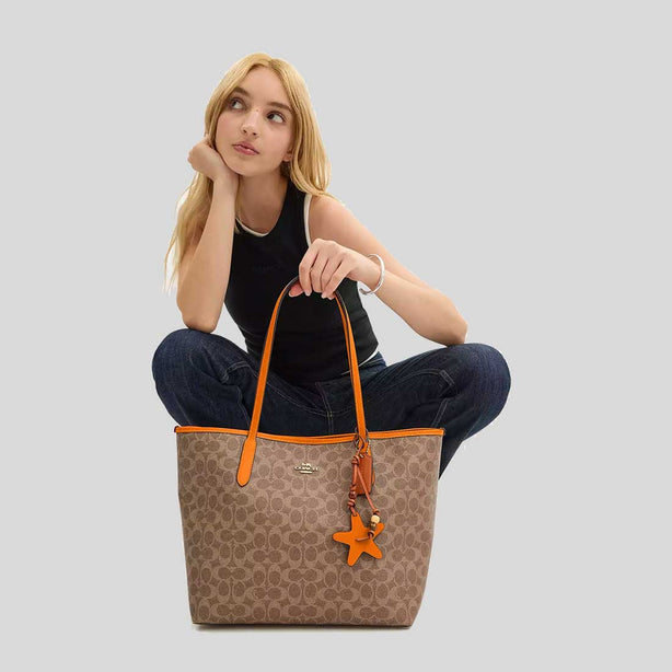COACH City Tote Bag In Signature Canvas With Star Charm Tan/Bright Mandarin CBH77