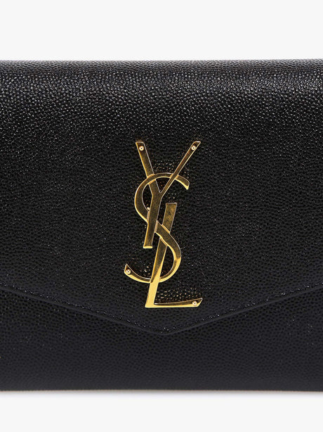 Saint Laurent Leather crossbody bag with metal Cassandre logo - Nero