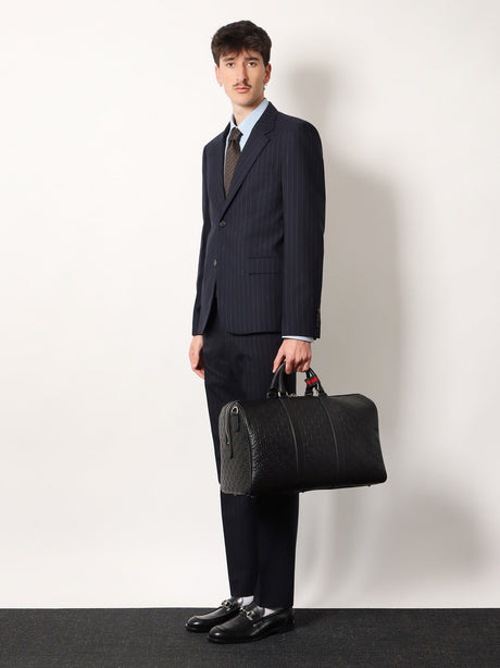Gucci Coated canvas GG Emblem travel bag with GG motif - Black
