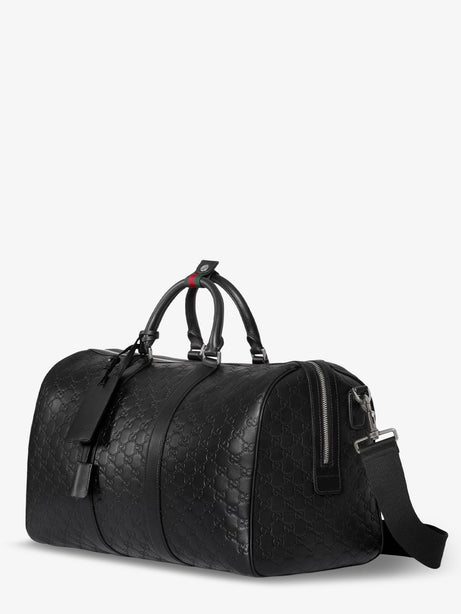 Gucci Coated canvas GG Emblem travel bag with GG motif - Black