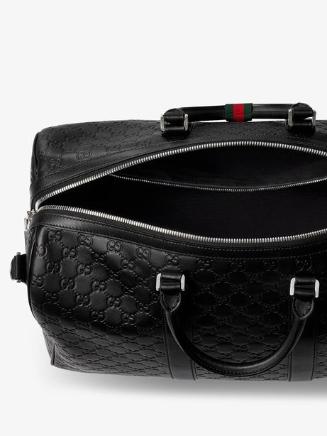 Gucci Coated canvas GG Emblem travel bag with GG motif - Black