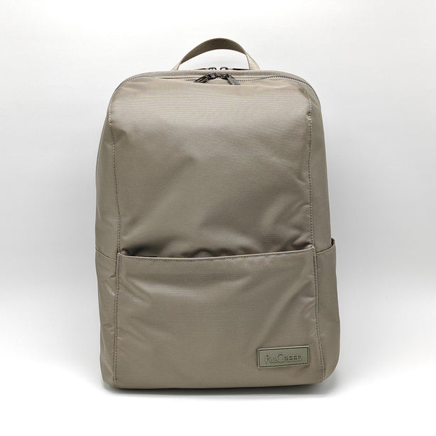 Ril Creed Polyester Backpack with front slip pocket, 2 side slip pockets and labtop compartment