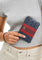 Coach Corner Zip Wristlet In Signature Canvas With Varsity Stripe - Denim/Bold Red